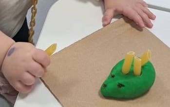 easy playdough activity for toddlers using pasta to build fine motor skills