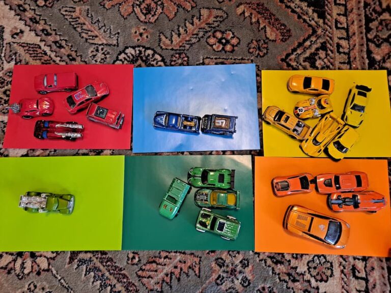 simple color sorting activity for toddlers using toy cars and colored paper. A fun and easy learning game to teach colors through play.