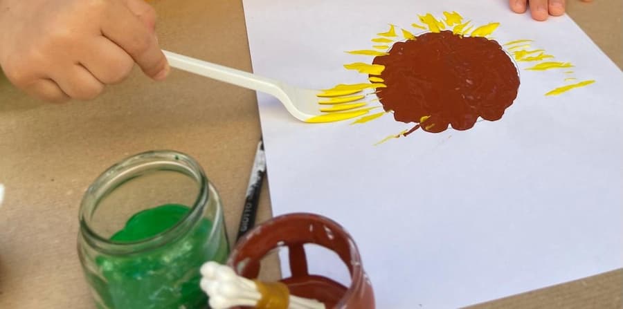 easy sunflower painting for kids using fork painting technique

