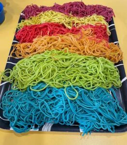 Colored Spaghetti Noodles Sensory Play: A Fun Toddler Activity That Turned Into Pretend Cooking Play