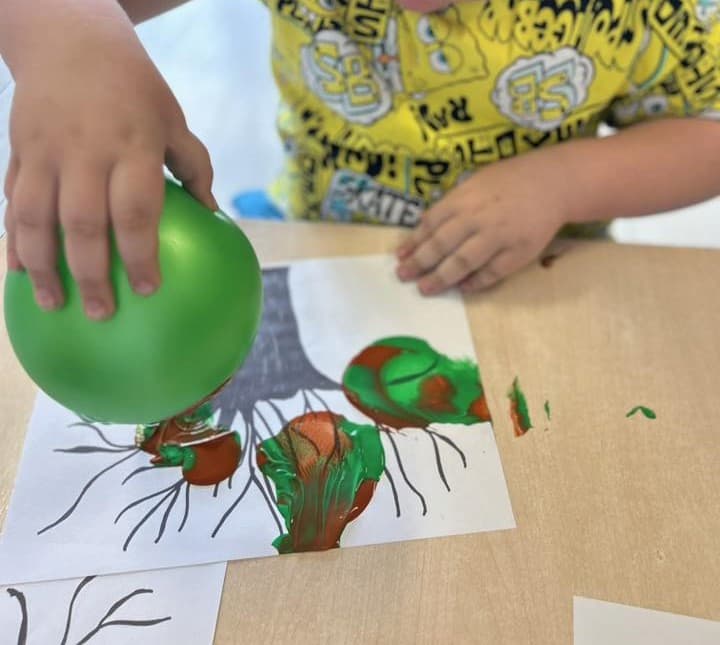 Balloons stamp perfect circles for apples, flowers, bubbles, and more.
